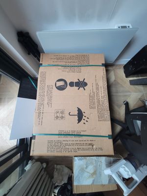 a box that is sitting on the floor next to a door
