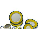 an image of a yellow and blue dinner set with a cup and saucer