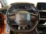 the interior of a car with a steering wheel and dashboard controls