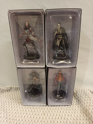 three boxes of star wars action figures sit on a table