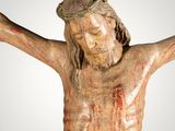 an image of a statue of jesus on the cross with blood all over it