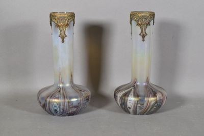two vases that are sitting on a table