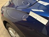 a picture of a car with a sticker on it ' s hood