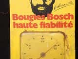 une boîte jaune sur laquelle figure l'image d'un homme barbu tenant un thermomètre