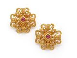 a pair of gold and ruby earrings