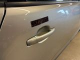 a close up of a car door handle with a sticker on it