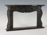a black marble fireplace mantle with a wooden top