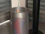 a metal trash can with a red and blue heart in it