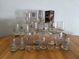 a lot of glasses sitting on a wooden table
