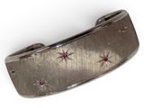 an image of a silver bracelet with pink stones on a white background