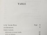 a table in the middle of a book with numbers on it