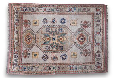 an old rug with many different colors and patterns
