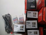 many boxes of electronic equipment sitting on a table