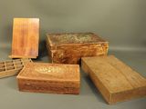 four wooden boxes sitting next to each other on a table