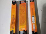 two boxes of orange toothpaste sitting next to each other on a table
