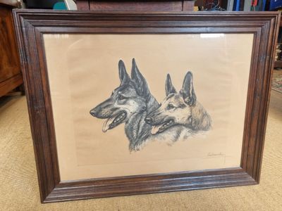 framed drawing of two german shepherd dogs sitting side by side in a living room