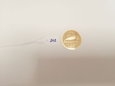 a gold coin with the number 22 on it