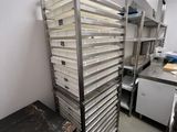 an image of a commercial kitchen with a rack of trays