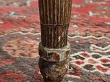 a close up of a vase on a rug