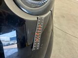 a close up of a parking meter on the street