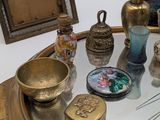 a glass table with a mirror and various items on it