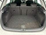 a trunk of a car with the back seats folded down