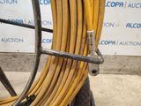 a yellow hose that is attached to a wire