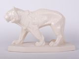 a white statue of a tiger on a white surface