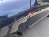 a close up of a car door with a hole in the side