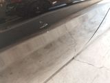 a close up of a car door with a bunch of flowers on it