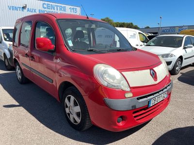 a red van parked in a parking lot next to other cars