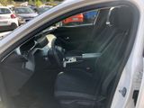 a white car with black seats in a parking lot