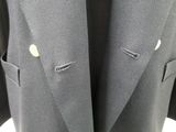 a close up of a suit jacket with buttons on a mannequin mannequin mannequin mannequin mannequin mannequin mannequin