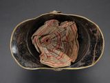 a hat with a cloth inside of it sitting on a table