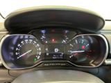 a close up of a car dashboard with a speedometer and gauges