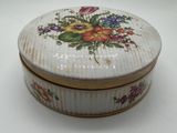 a small white box with a floral design on it