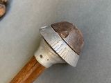 an image of a hammer and some nuts on a table
