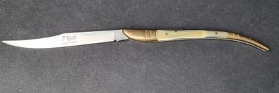 a knife that is laying on a table