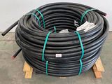 a pile of black hoses sitting on a pallet