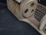 a bird that is sitting inside of a bird cage
