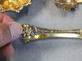 a person that is holding a spoon and a spoon