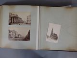 an open book with pictures of buildings on it