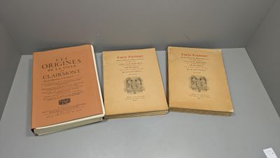 three books sitting on top of a table next to each other