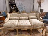 a couch that is sitting in the middle of a room