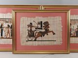 two framed pictures of a man riding a horse and a woman on a carriage