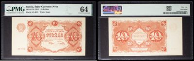 two old red and white paper currency on display in a black frame
