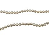 a close up of a pearl necklace on a white background
