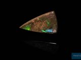 an oplite triangle shaped piece with green and blue lights
