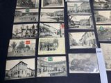 a lot of old postcards on display on the table