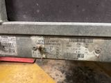 a close up of the back of a truck with a lot of labels on it